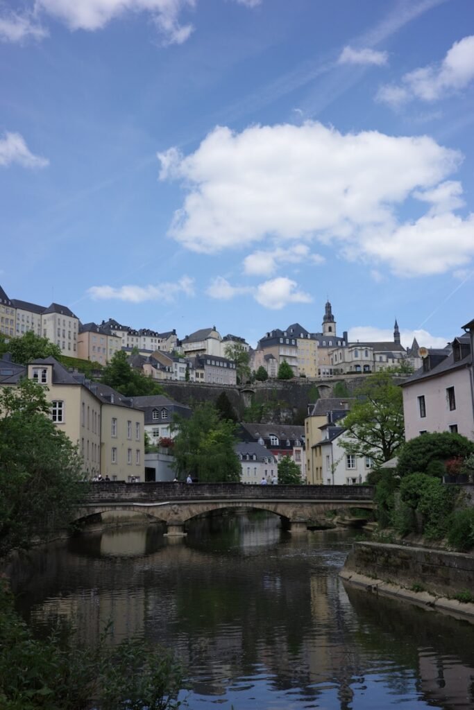 a river running through a small town next to a bridge