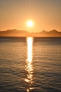 body of water during sunset