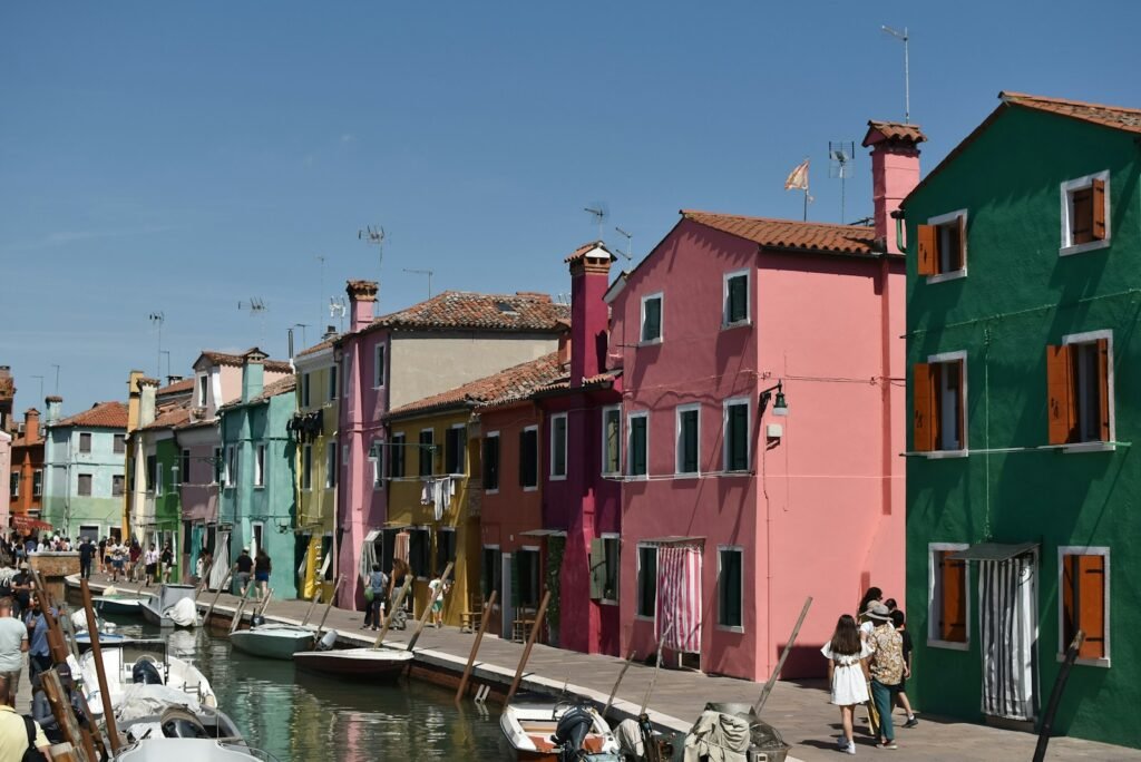 a group of colorful buildings next to a body of water