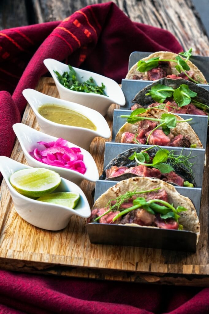 a wooden tray topped with different types of food