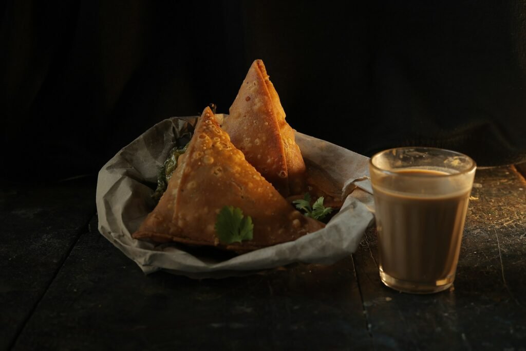 A plate of food next to a cup of coffee